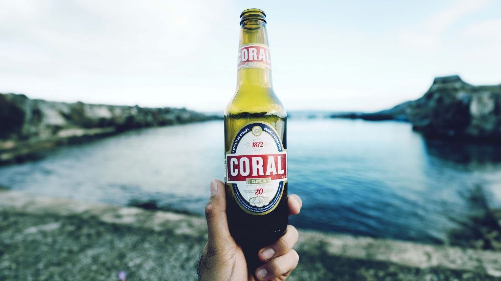 Coral beer bottle at the beach